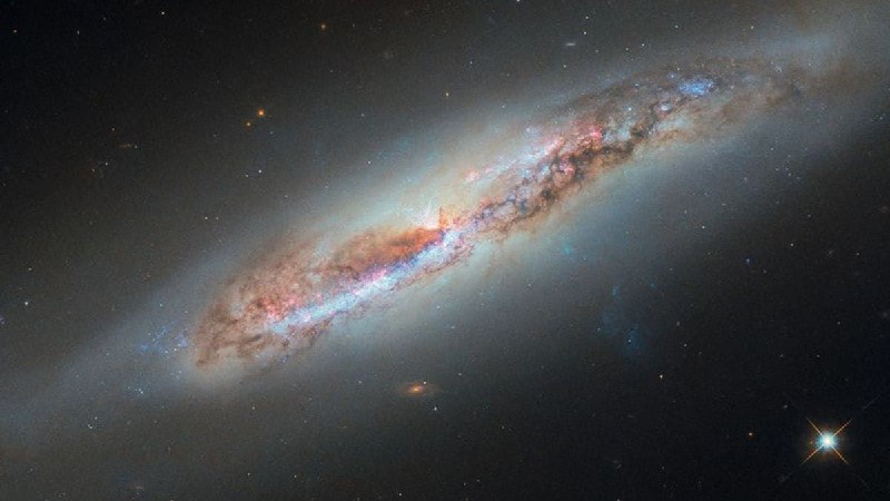 Hubble captures glowing gas plume from distant galaxyNASA's Hubble Space Telescope captured a glowing plume of gas streaming from spiral galaxy NGC 4388, located 60 million light-years away in the constellation Virgo, as the galaxy plunges through hot intracluster gas that strips material from its disk.The James Webb Space Telescope discovered exoplanet PSR J2322-2650b, a Jupiter-mass world with an unprecedented helium-and-carbon-dominated atmosphere orbiting a pulsar every 7.8 hours, with gravitational forces distorting it into a lemon shape.Scientists say the carbon-rich atmospheric composition, including molecular carbon compounds C3 and C2, defies explanation under current planetary formation theories, as it suggests an absence of oxygen and nitrogen unlike any known planet.Source
