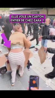 אישה נושאת בגדים מחנות זארה שנבזזה בצרפת מתעמתת עם גבר שמכנה את הגניבה "חראם", ואומרת לו שהיא יהודייה, לא מ…